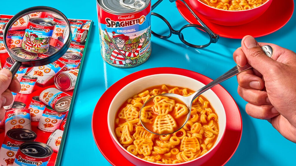 Pasta rings in tomato sauce in pan for healthy family meals.