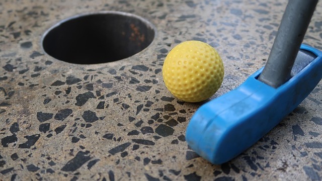 San Antonio family activities: Fun mini-golf with candy heart backdrop