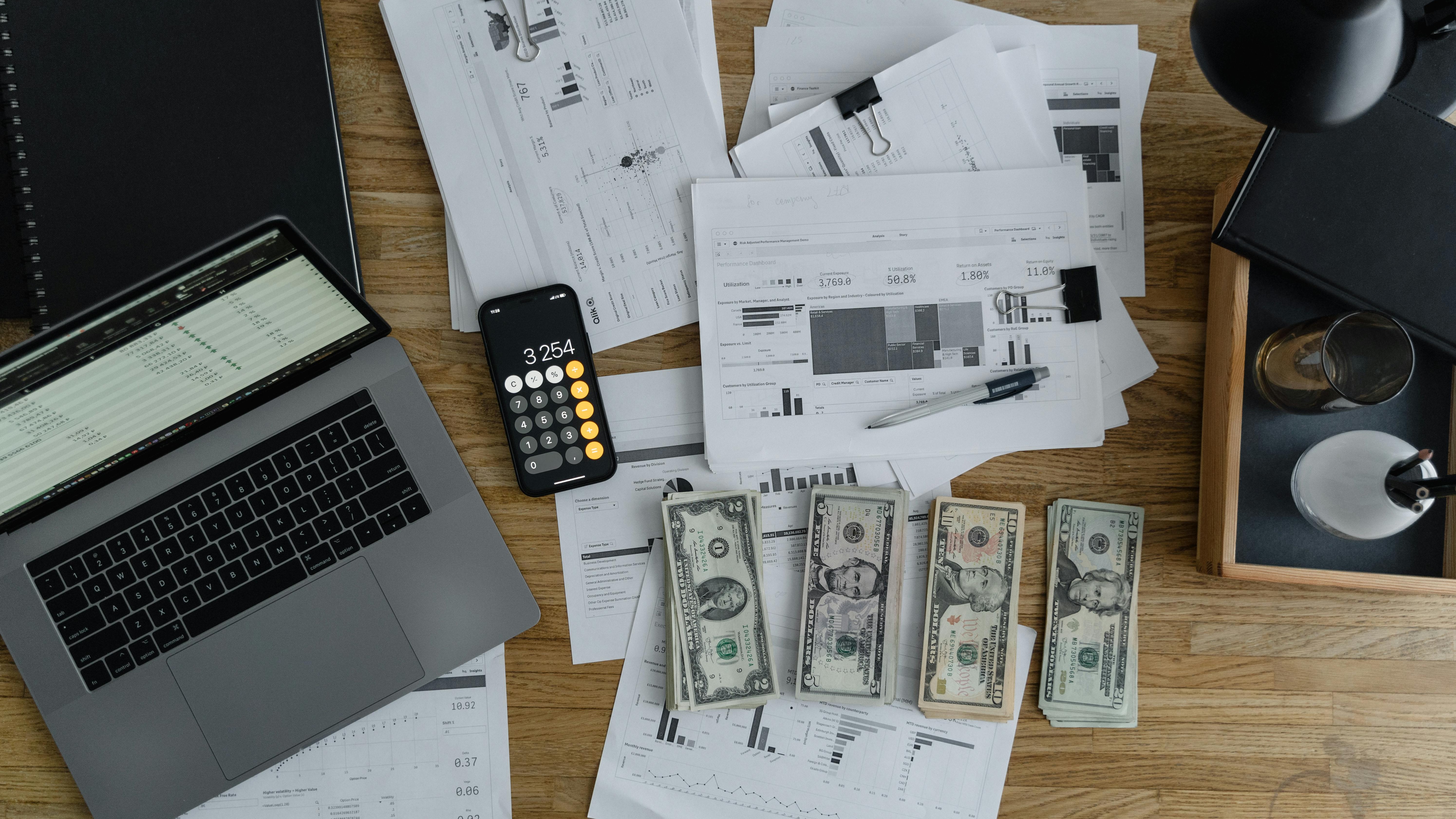 Businessman managing finances with a credit card, highlighting employee financial well-being support.