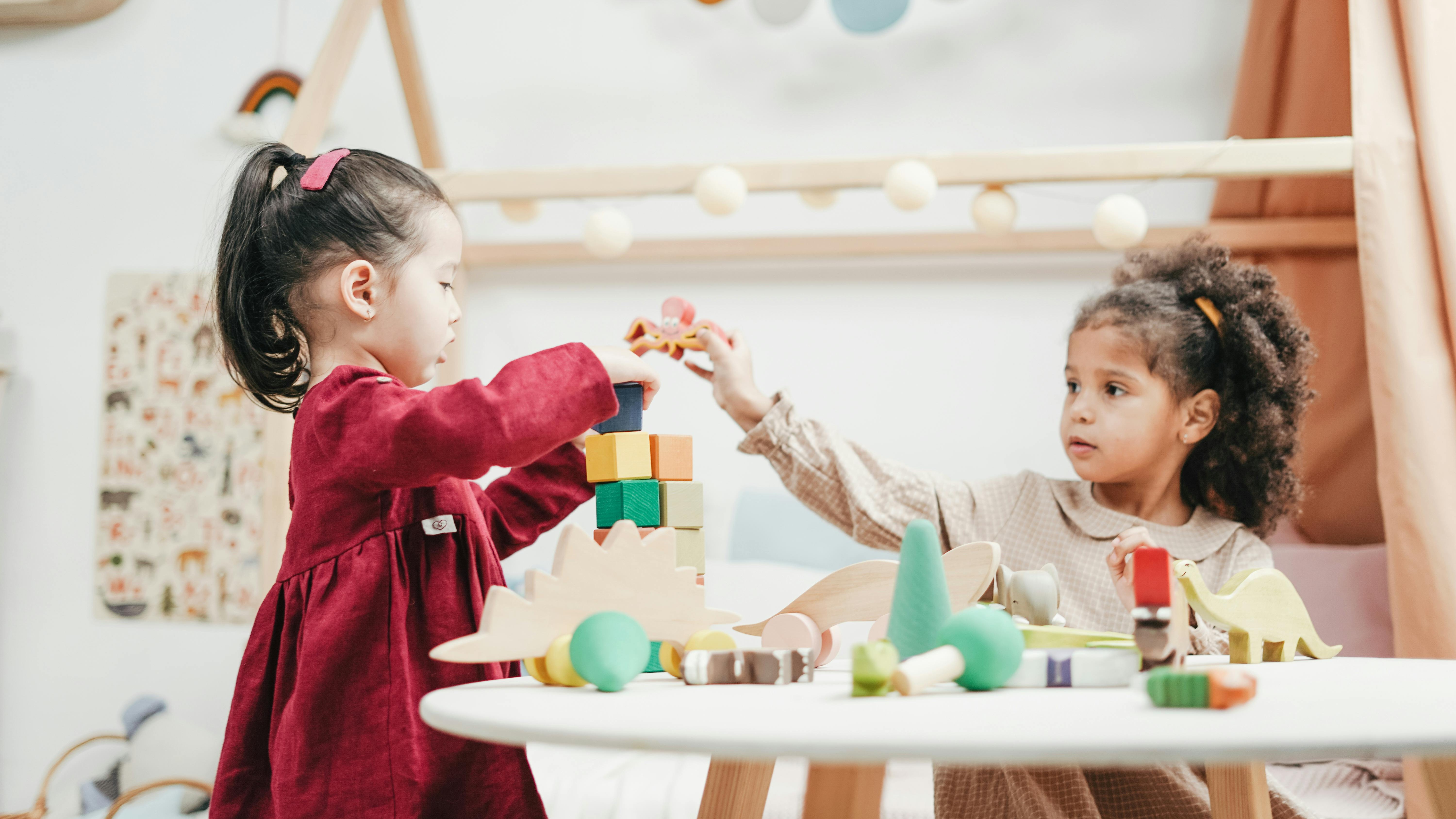 On-site child care in a vibrant outdoor setting with caregivers.