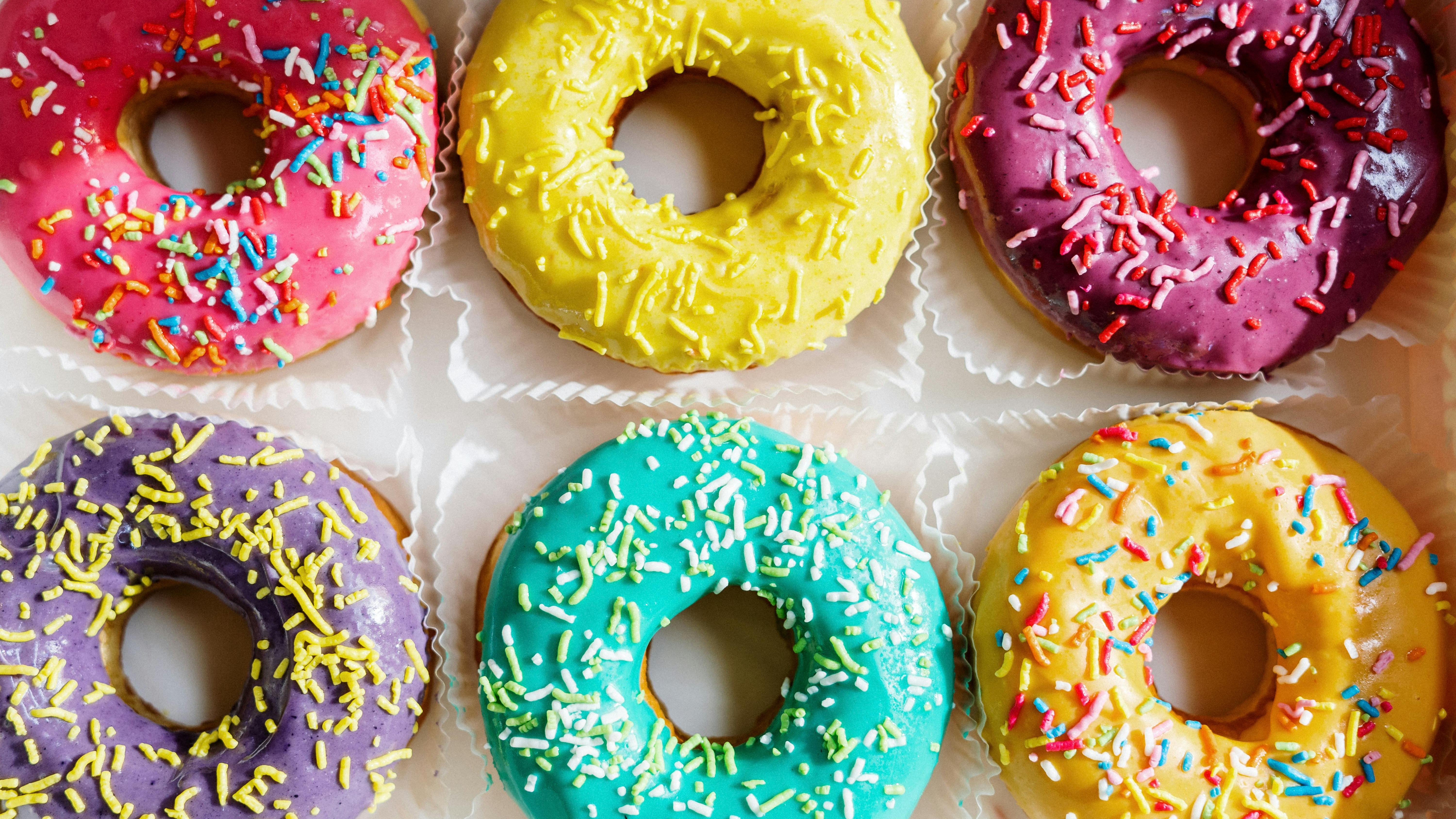 Colorful sprinkled donuts for National Donut Day 2025.