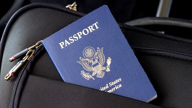Travelers at airport related to H-1B visa changes.