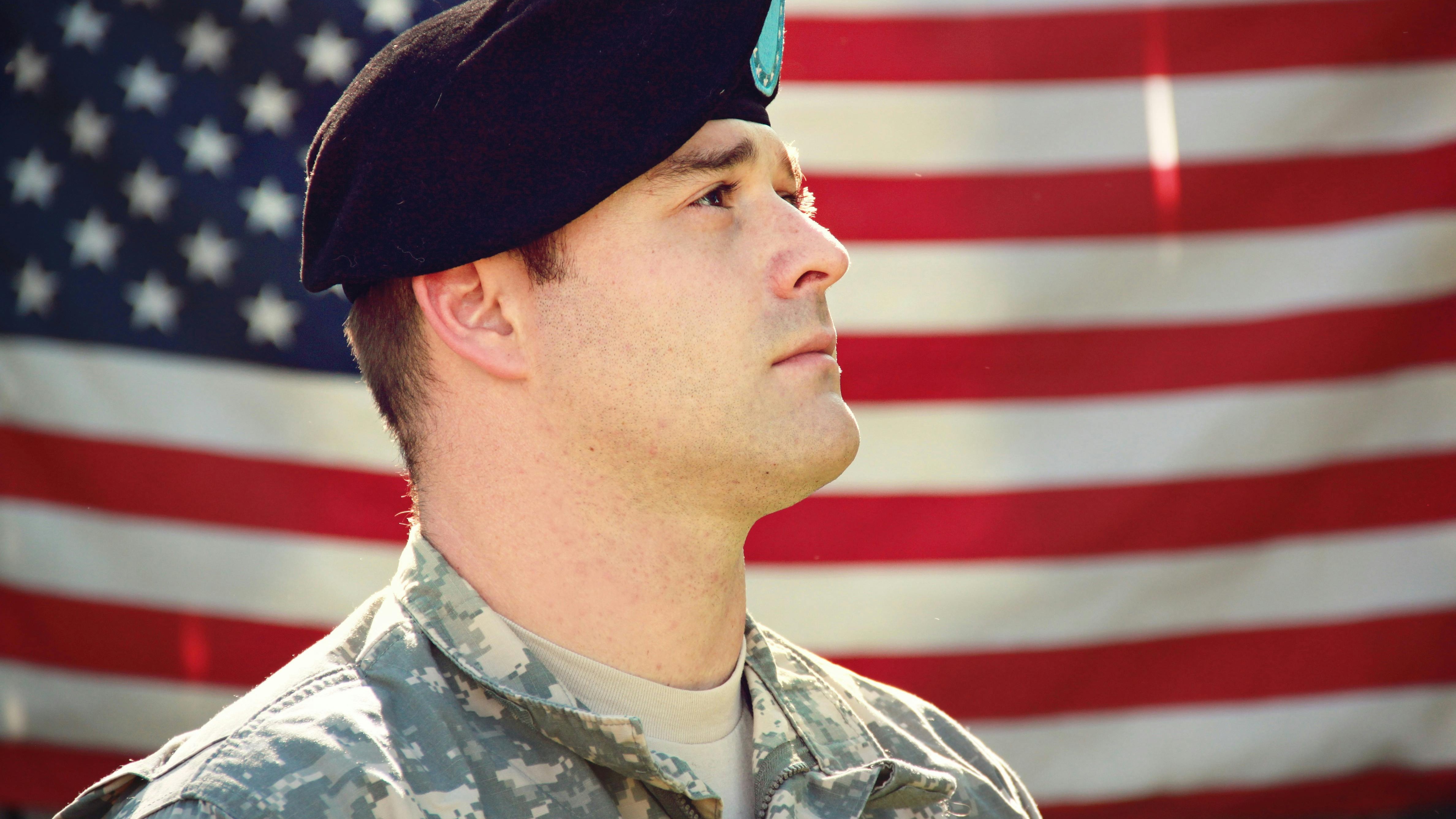 Military personnel training at field, focusing on veteran opportunities.