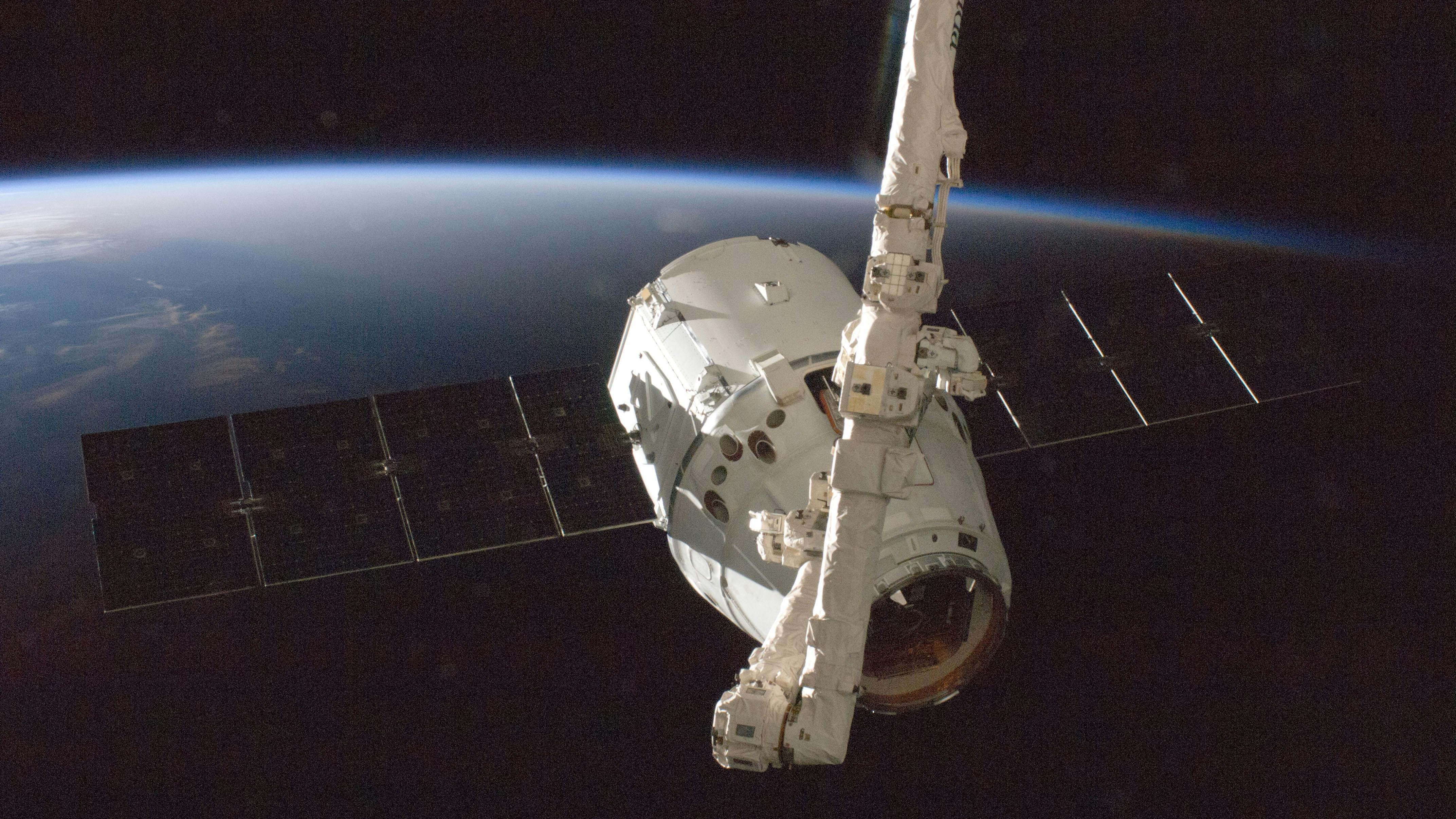 Starlink satellite dish on building roof with clouded sky