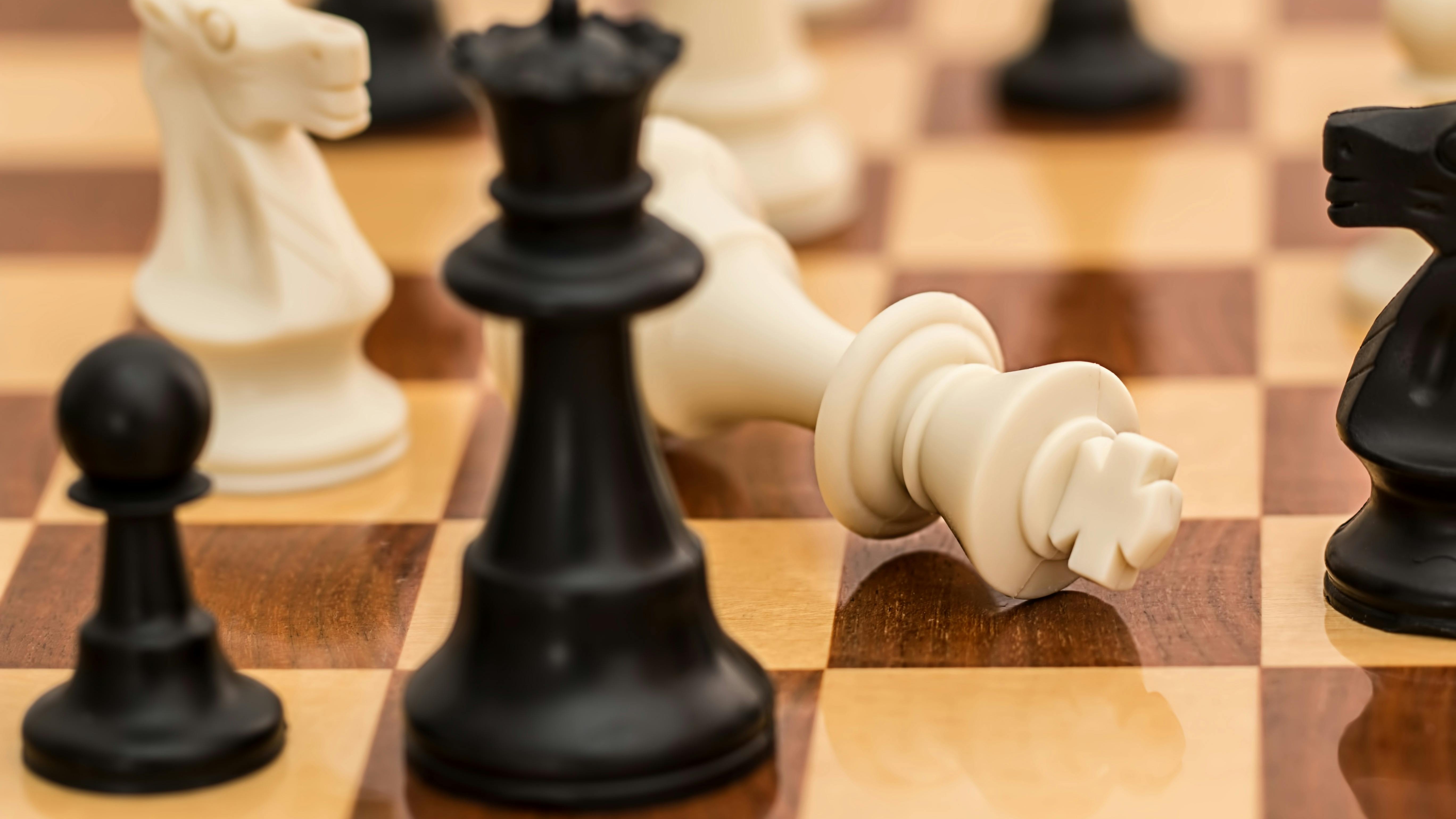 Children playing chess at tournament, promoting STEM education.
