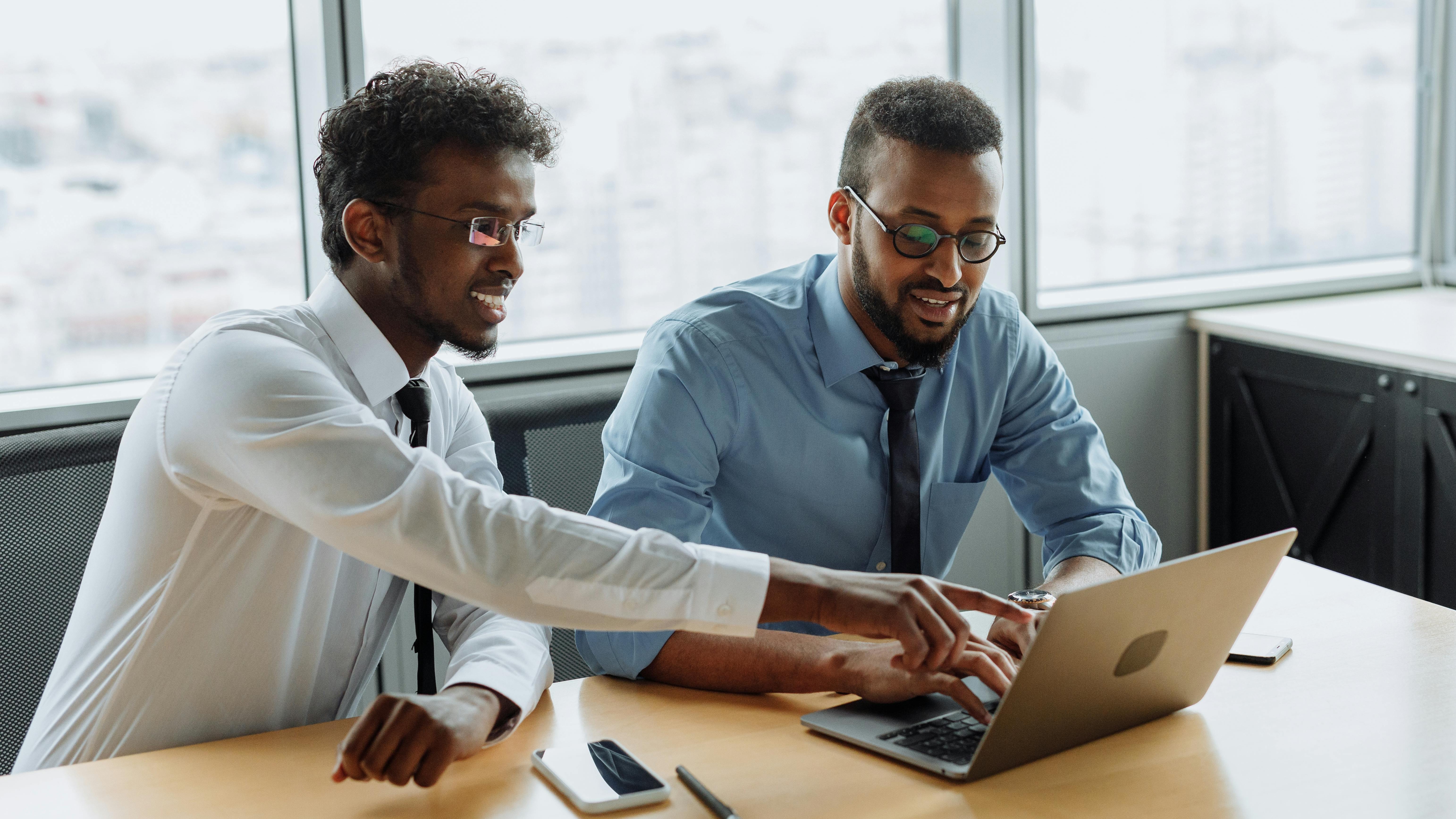 Diverse workplace culture depicted by business professionals at an event.