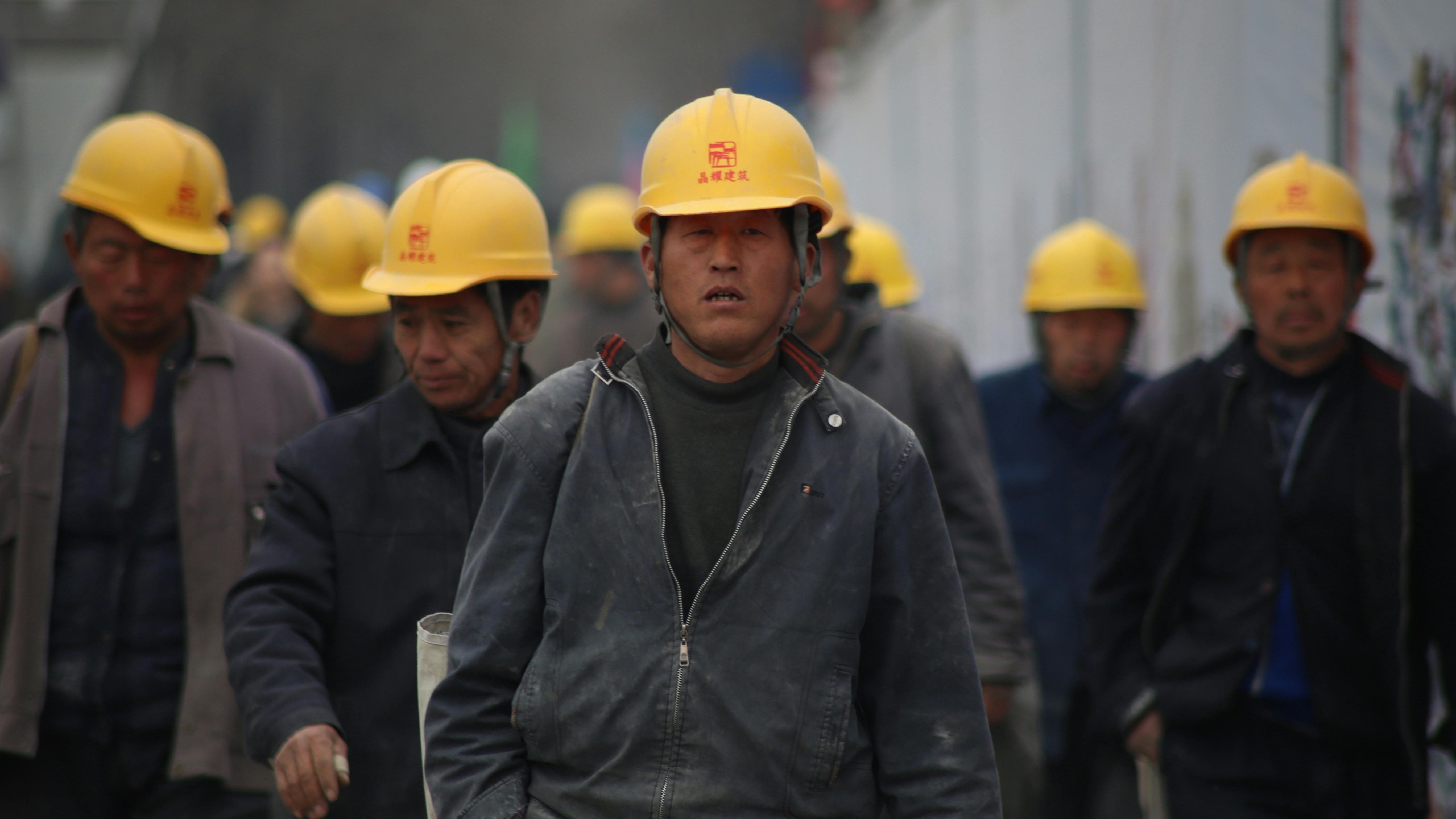 Memorial banner on construction site related to Building Safety Act luxury hotels.