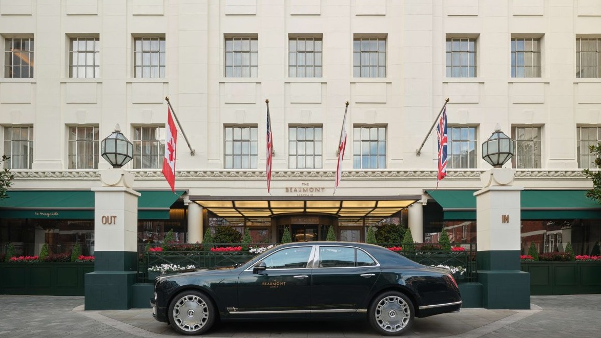 Luxury hotel entrance with staff posing