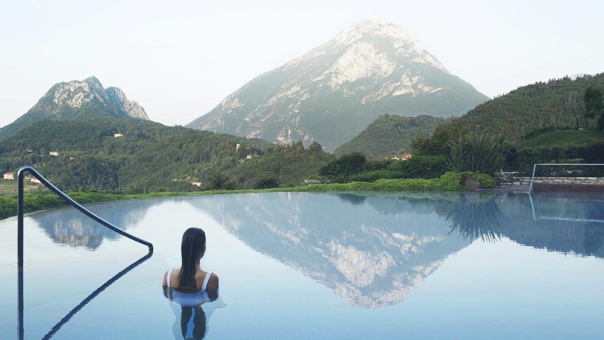 Luxurious eco-friendly villa nestled in lush forest for sustainable travel.