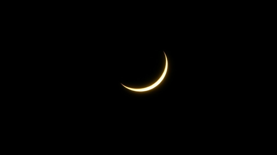 Glowing crescent moon symbol, suggesting nighttime ambiance.
