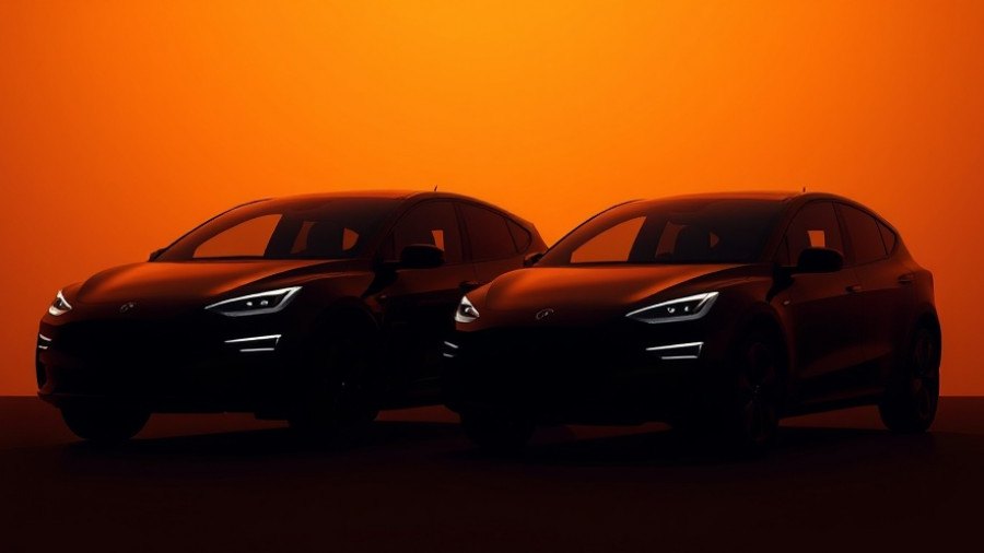Sleek electric vehicles showcasing Lucid self-driving technology in low light.