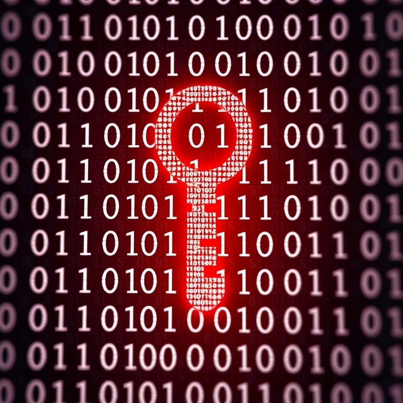 Cybersecurity threats visualized as a key in binary code.