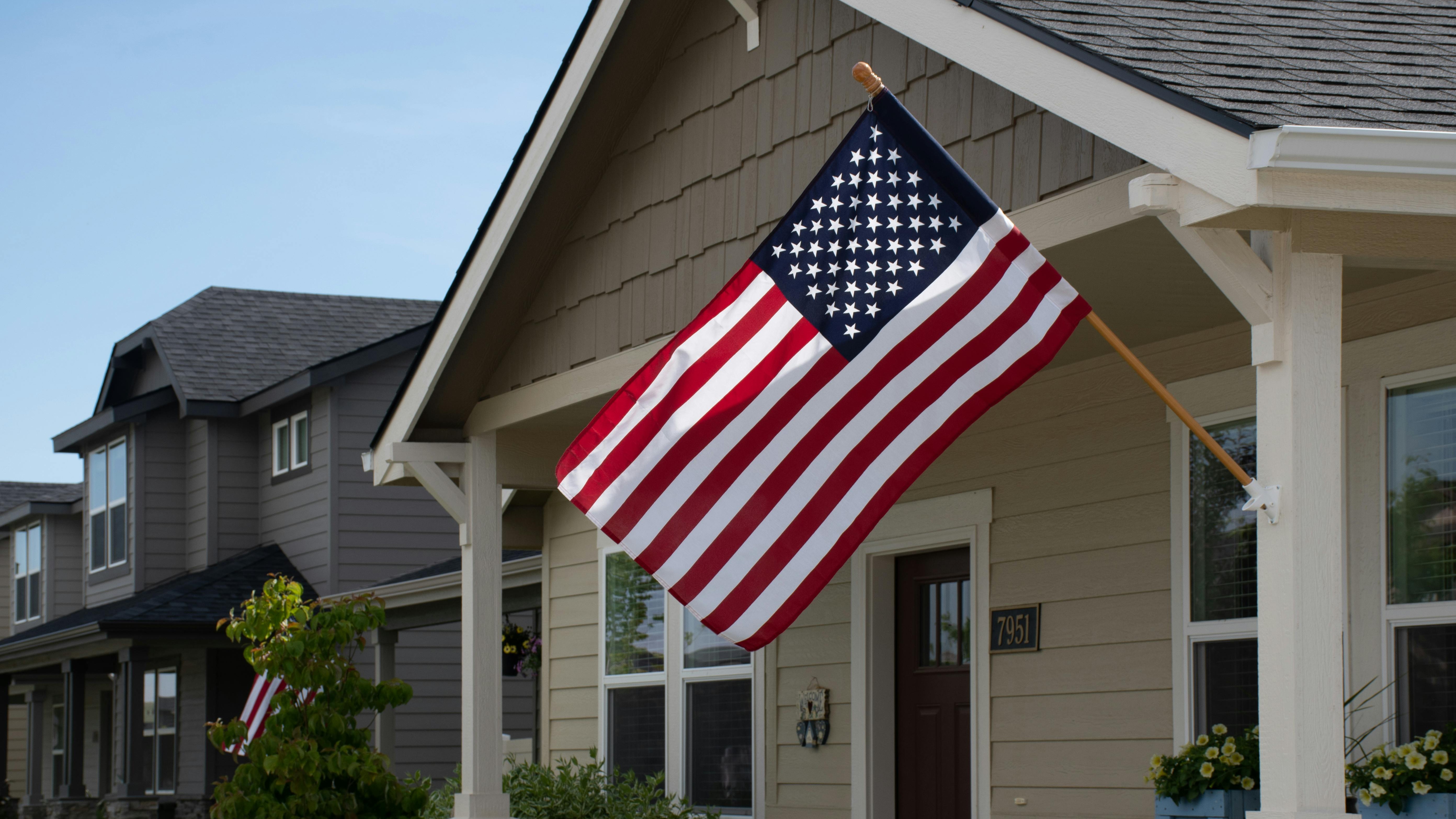 American Flag with beautiful homes