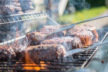 juicy burgers sizzling on a barbecue
