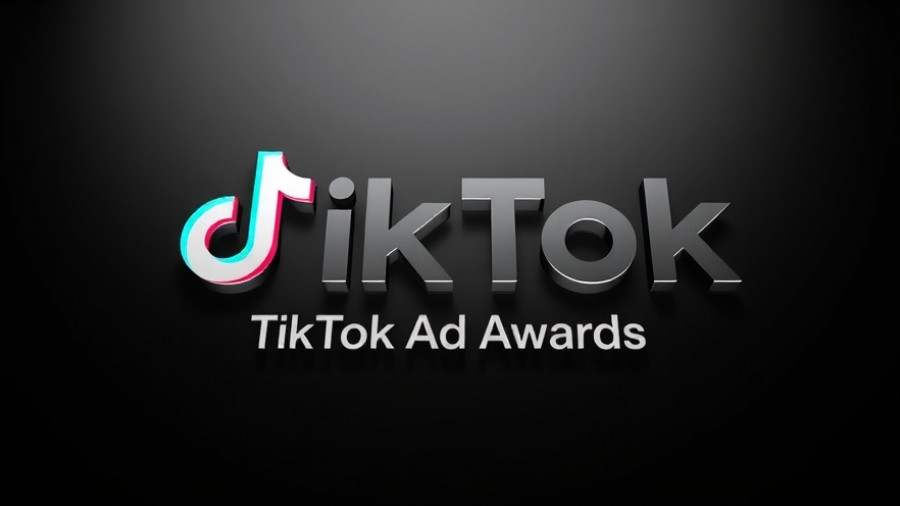 3D glass TikTok logo with 'TikTok Ad Awards' text on black.