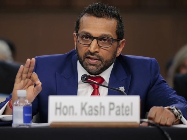 Distinguished man in blue suit speaks at a congressional hearing.