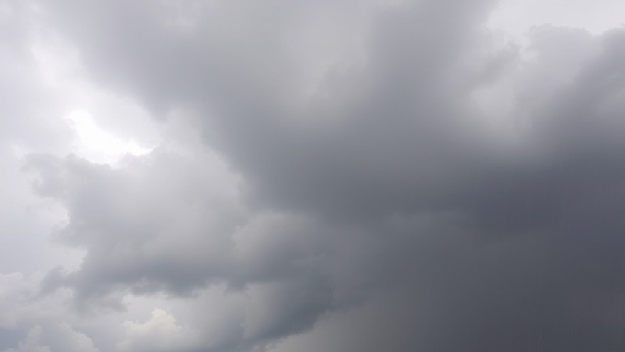 Cloudy skies with rain threatening over San Antonio, showcasing recent weather updates.