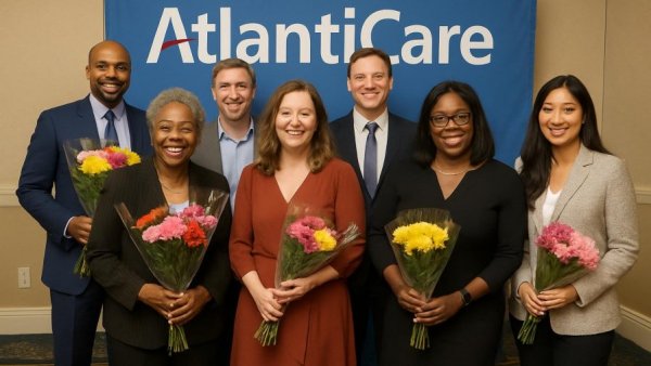 Award ceremony with smiling recipients, healthcare scholarships New Jersey.