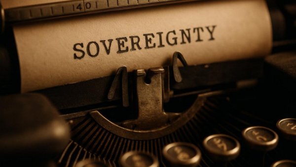 Vintage typewriter typing 'SOVEREIGNTY'; NJ Transit sovereign immunity concept.