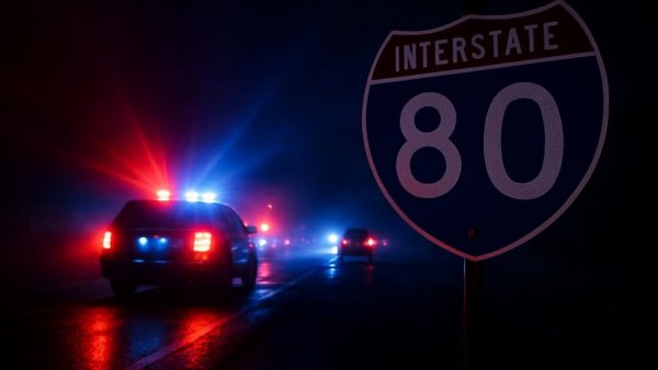 Morris County I-80 crash scene with police lights and road sign.