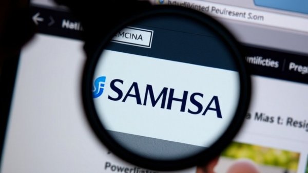 SAMHSA website magnified, highlighting mental health funding restoration.