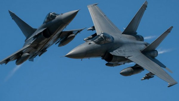 Navy jets performing aerial maneuvers showcasing air show safety.