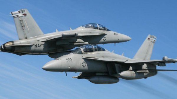 Navy Growlers in close midair maneuver for collision survival.
