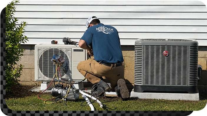 Anderson Heating and Colling technician installing a residential heat pump Central Kentucky
