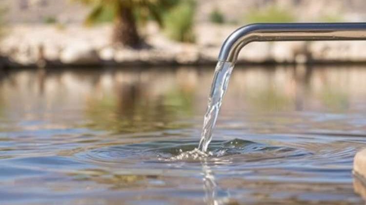 Outdoor water spigot flowing into lake with desert landscaping in Las Vegas, representing local water quality concerns