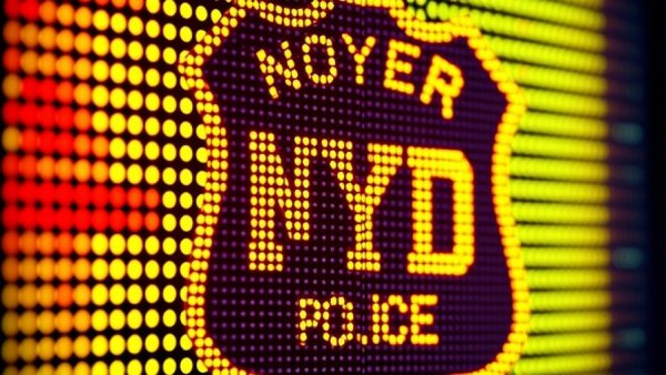 Vibrant dotted NYPD badge on LED display, NYPD Muslim surveillance lawsuit context.