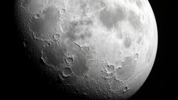 Frozen moon surface in space showcasing icy textures and cracks.