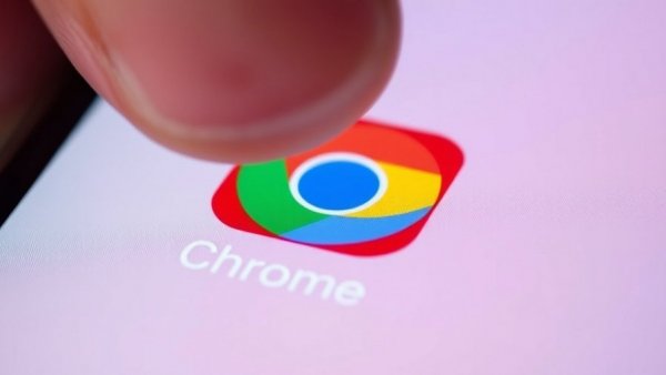 Close-up of Google Chrome app icon on a phone indicating security flaws.