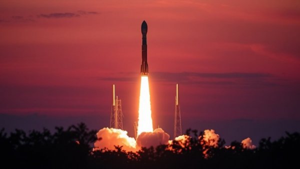 SpaceX Falcon 9 rocket launch at sunset, dramatic sky.