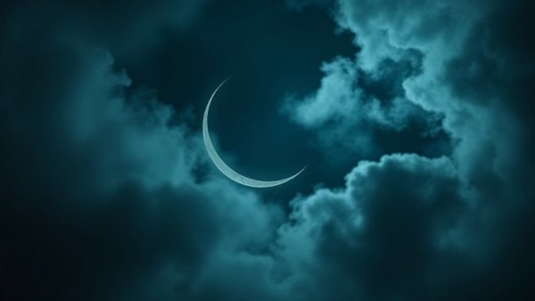 Ethereal crescent moon in misty space atmosphere
