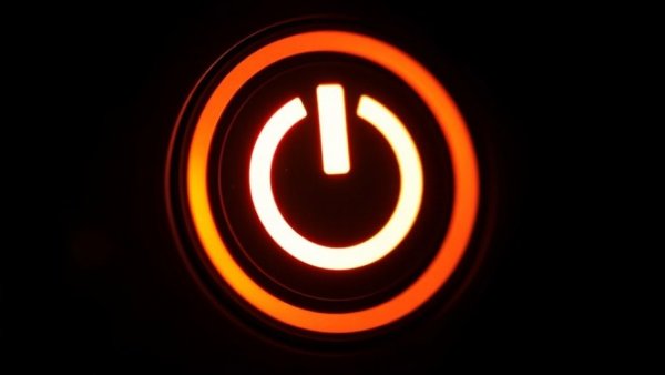 Close-up of a glowing power button symbolizing self-aware AI systems dignity