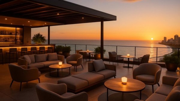 Elegant rooftop bar in San José Del Cabo overlooking ocean at sunset.