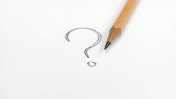 Question mark and pencil on white surface, symbolizing startup idea validation.