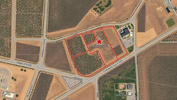 Satellite map with proposed Kelowna animal clinic site marked.
