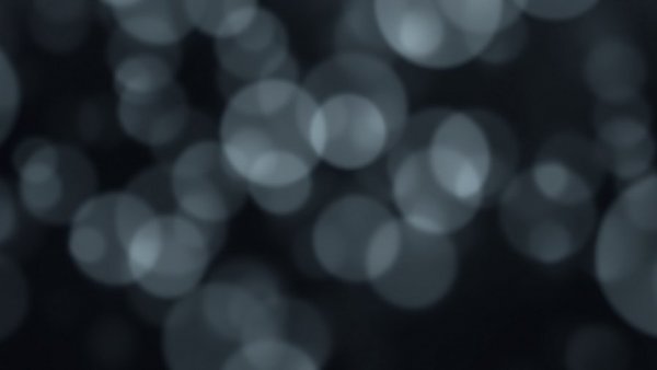 Abstract blurred shapes in monochrome, creating futuristic atmosphere.