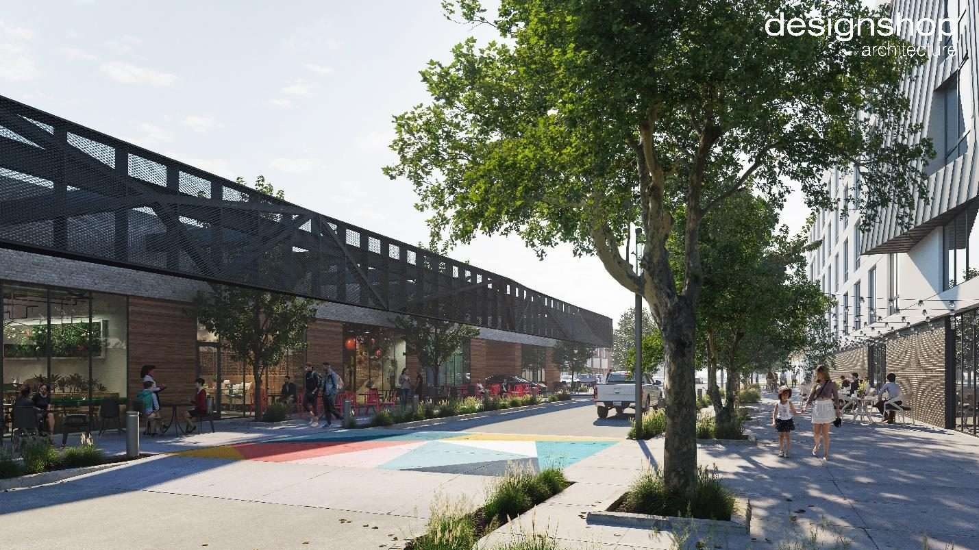 Union Station streetscape rendering in Memphis with storefront patios, shade trees and a painted crosswalk, designed by designshop architecture