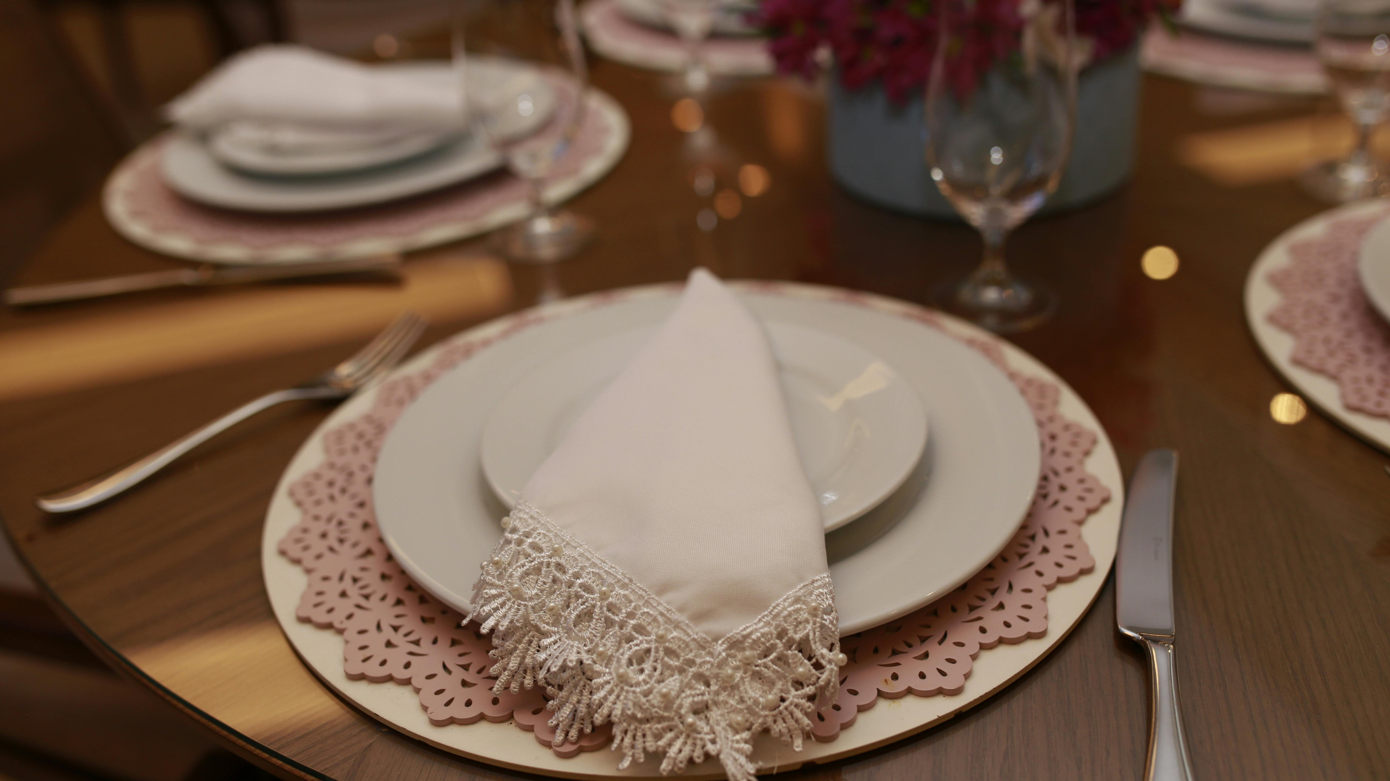 Confused woman learning to set a table correctly.