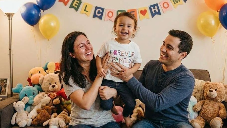 Symbolic National Adoption Day representation with family icons.