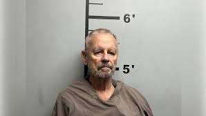 Bella Vista murder case scene with yellow crime tape in the woods.