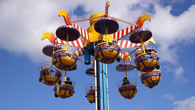 Washington County Fair teacup ride with colorful play area.
