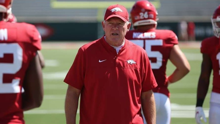 Arkansas Razorbacks coach discusses quarterback options at a press conference.