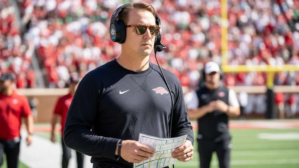 Eric Morris Arkansas coach candidate pondered with sports-themed graphic.