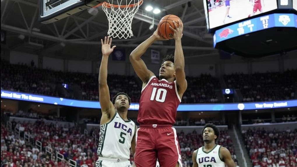 Arkansas athletes shaping their future, basketball players in action on court.