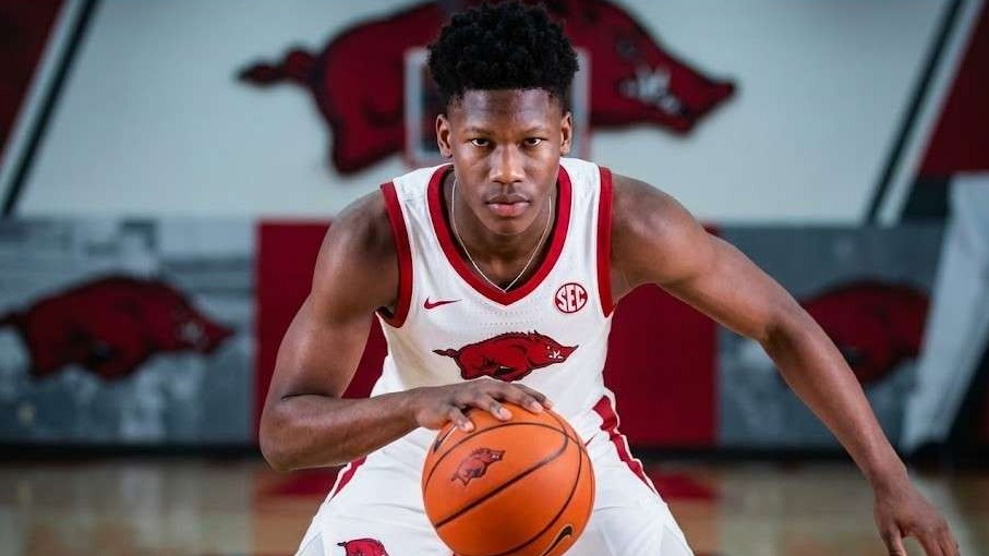 JJ Andrews Arkansas basketball signee laughing during signing.