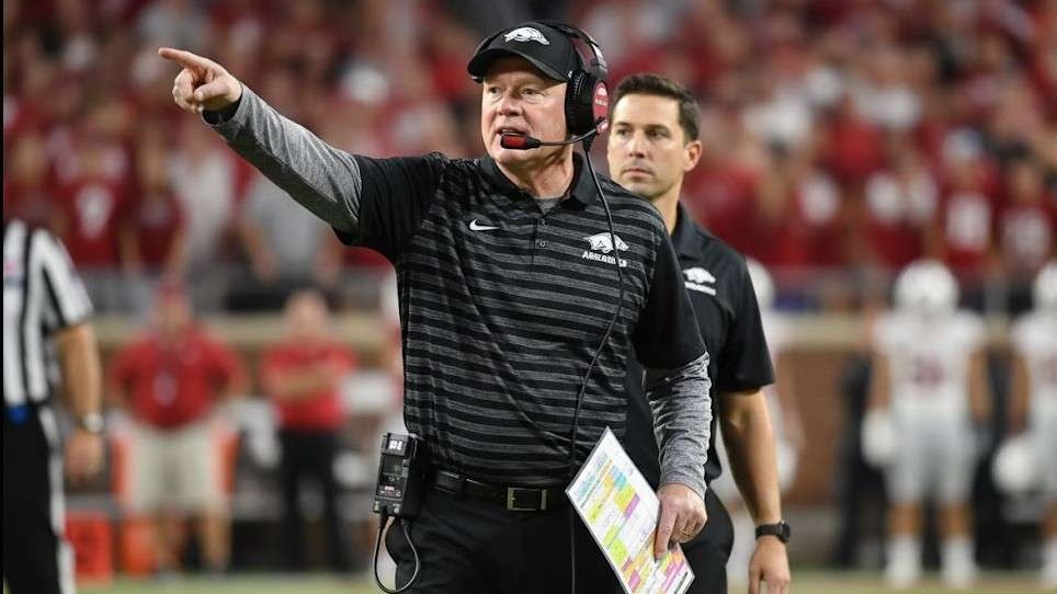 Arkansas Razorbacks coach discusses quarterback situation at press conference.