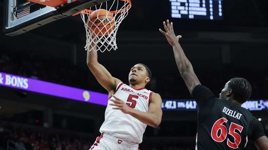 Arkansas Razorbacks press conference with speaker at podium.